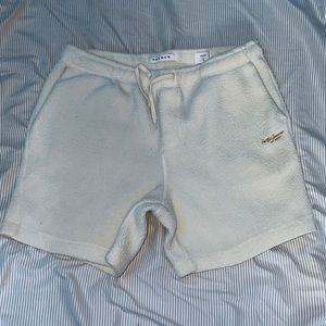 Medium sized, cream color Sherpa material PacSun volley shorts